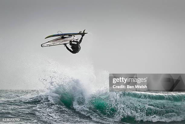 windsurfing jumping action. - windsurfing fotografías e imágenes de stock