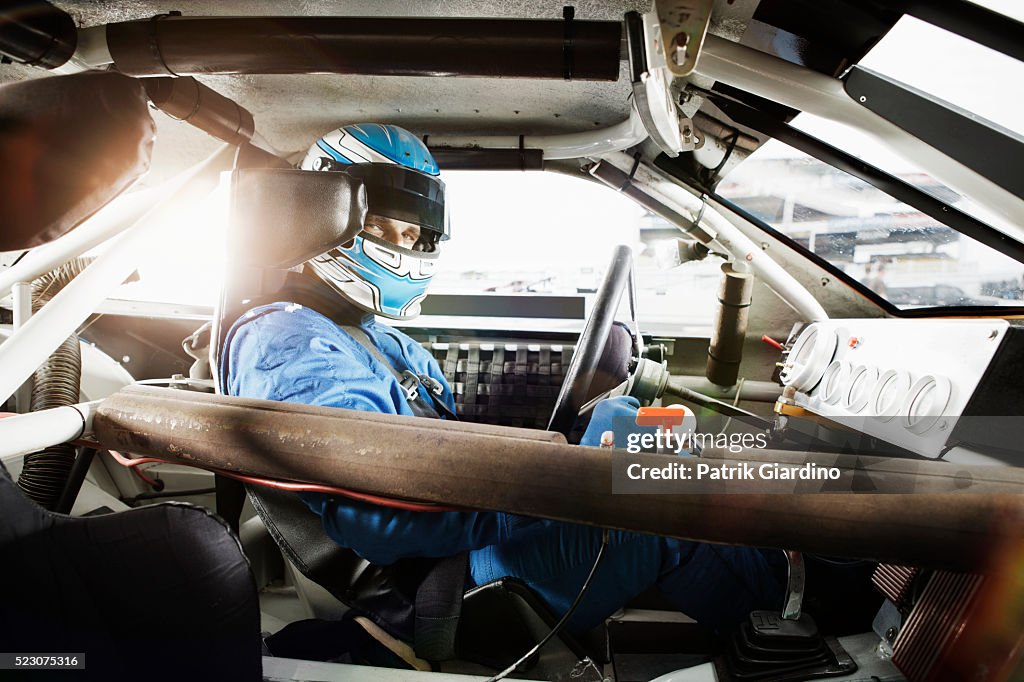 Driver sitting in racecar