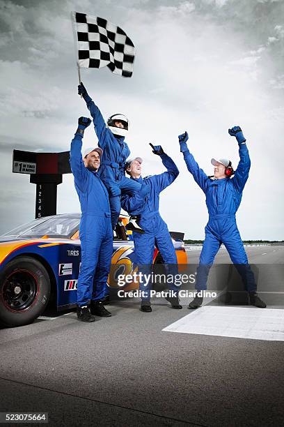 race car drivers winning car race - nascar track stock pictures, royalty-free photos & images