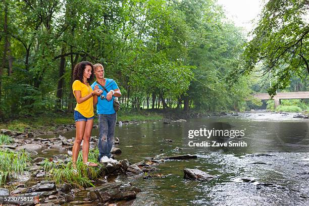 young couple fishing in stream, coatesville, pennsylvania, usa - coatesville stock pictures, royalty-free photos & images