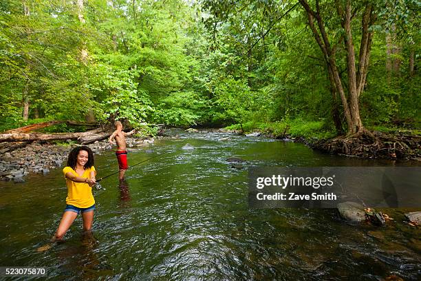 young couple fishing in river, coatesville, pennsylvania, usa - coatesville stock pictures, royalty-free photos & images