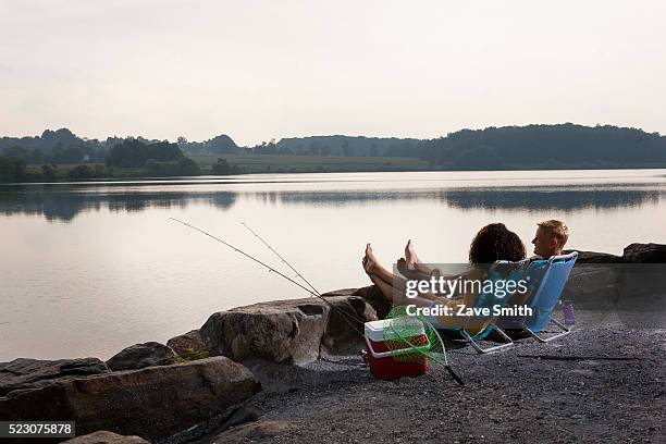 young couple fishing in river, coatesville, pennsylvania, usa - coatesville stock pictures, royalty-free photos & images