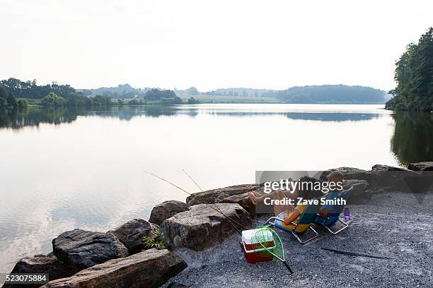 young couple fishing in river, coatesville, pennsylvania, usa - coatesville stock pictures, royalty-free photos & images