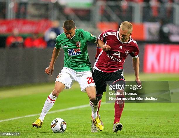 Andres Wolf von Nuernberg kaempft um den Ball mit Marcel Ndjeng von Augsburg waehrend des Bundesliga Relegationspiels 1. FC Nuernberg gegen den FC...