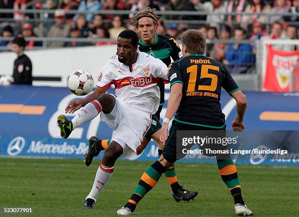 Cacao of Stuttgart and Sebastian Proedl of Bremen battle for the ball during the Bundesliga match between VfB Stuttgart and Werder Bremen at the...