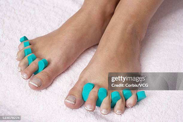 young woman with toe separators - toe separators stock pictures, royalty-free photos & images