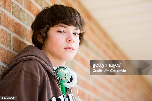 sullen teenage boy - one teenage boy only stock pictures, royalty-free photos & images