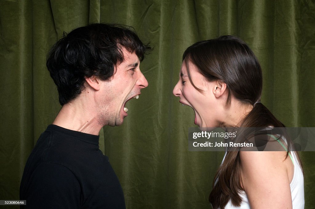 Couple yelling face to face