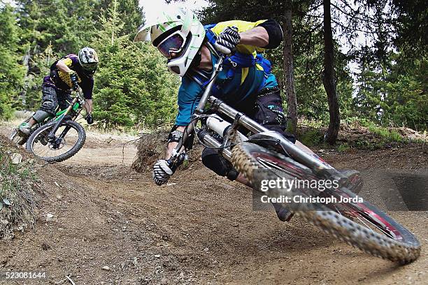 two bikers riding on a trail - downhill mountain biking stock pictures, royalty-free photos & images