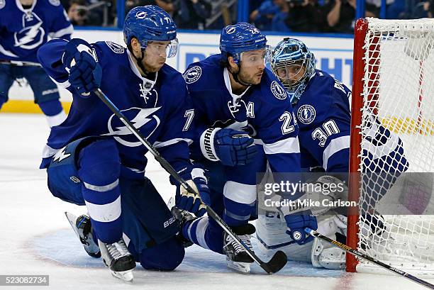 Victor Hedman. Ryan Callahan and Ben Bishop of the Tampa Bay Lightning defend against the Detroit Red Wings during the third period in Game Five of...