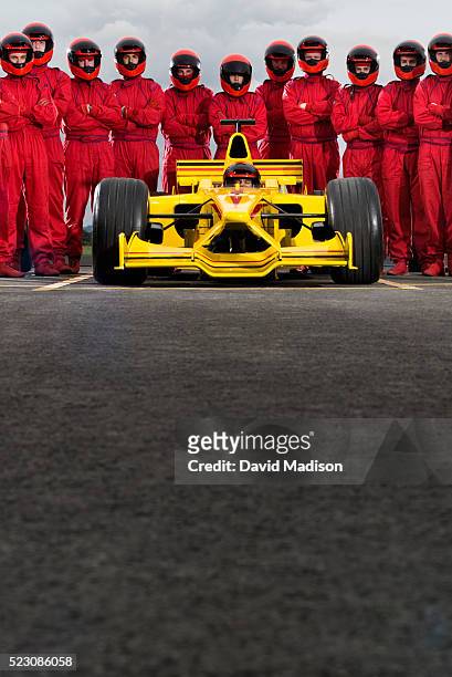 formula one racing team and racecar - pit stop stock pictures, royalty-free photos & images