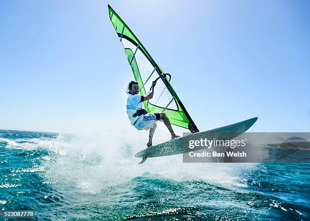 windsurfing action. - windsurfing fotografías e imágenes de stock