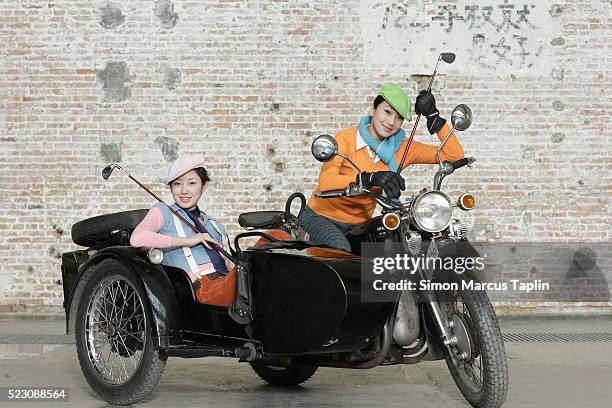 women on motorcycle with side car - sidecar stock pictures, royalty-free photos & images