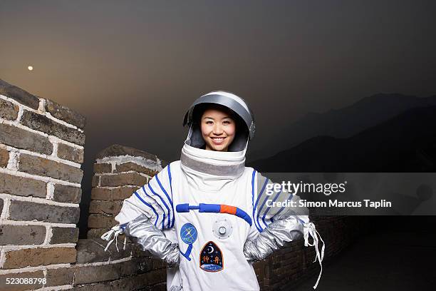 woman dressed as an astronaut - astronaut portrait stock-fotos und bilder