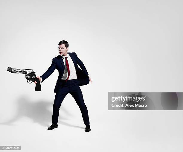 Man With Revolver 13,873 Guy Holding Gun Stock Photos, High-Res Pictures, and Images ...