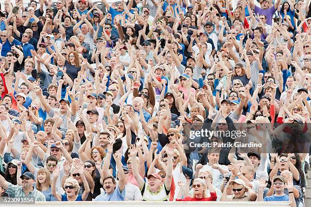 spectators watching car racing - nascar rennen stock-fotos und bilder