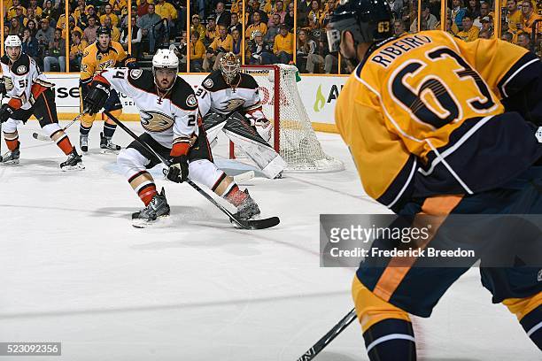 Simon Despres of the Anaheim Ducks watches Mike Ribiero of the Nashville Predators carry the puck during the third period in Game Four of the Western...