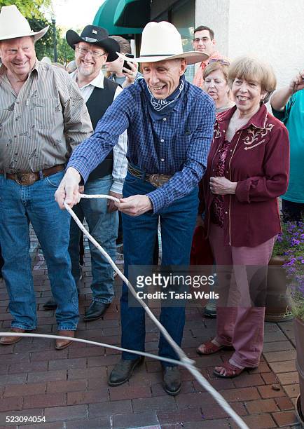 Television and film legend Johnny Crawford ropes around his star during the unveiling ceremony at The Walk of Western Stars on April 21, 2016 in...