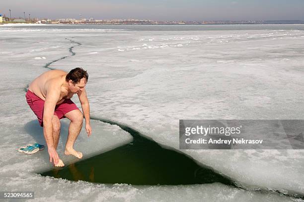 ice swimming in the frozen black sea, a rare phenomenon which last occured in 1977, odessa, ukraine, eastern europe - winter swimming stock pictures, royalty-free photos & images
