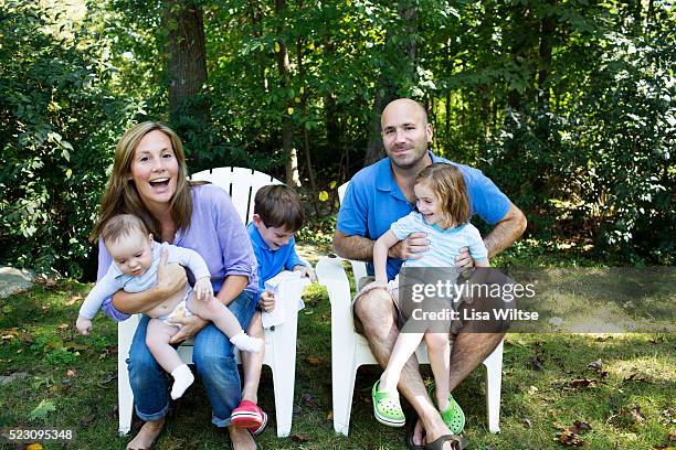 portrait of parents with kids (2-5 months, 2-5) in garden - 2 5 months stock pictures, royalty-free photos & images