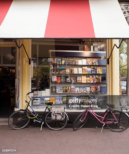 bicycles parked outside bookstore - bookstore ストックフォトと画像