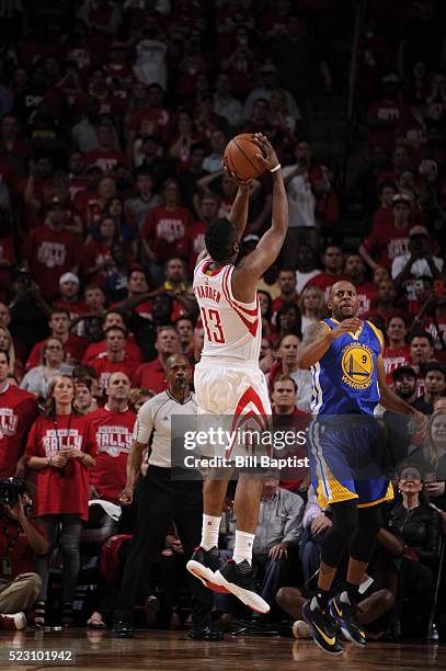 James Harden of the Houston Rockets scores the winning basket against the Golden State Warriors in Game Three of the Western Conference Quarterfinals...