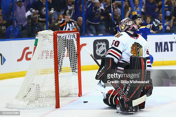 Corey Crawford of the Chicago Blackhawks reacts after allowing a goal against the St. Louis Blues in Game Five of the Western Conference First Round...