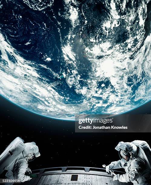 astronaut floating in space - astronaut imagens e fotografias de stock