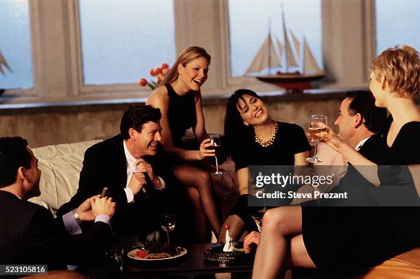 couples laughing at a cocktail party - drinking alcohol at home stock pictures, royalty-free photos & images