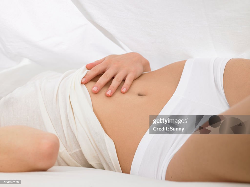 Young Woman Lying in Bed