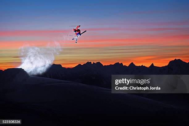 freeskier jumping in air during sunset - skier silhouette stock pictures, royalty-free photos & images