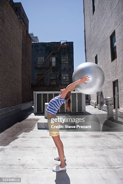 young woman exercising - yoga ball outside stock pictures, royalty-free photos & images