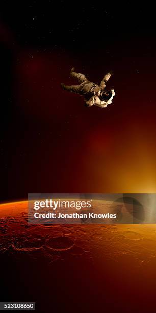 astronaut floating in space - astronaut floating stock pictures, royalty-free photos & images