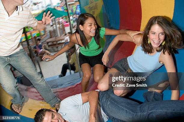 teenage friends in fun house - fun house stock pictures, royalty-free photos & images