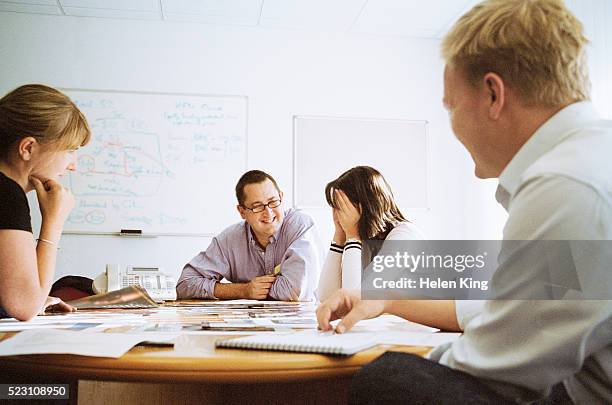 embarrassed woman during meeting - awkward stock pictures, royalty-free photos & images