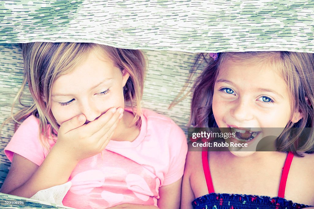 Two young girls (6-9) laughing and having fun