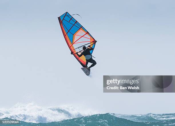 windsurfer doing a forward loop. - wind surfing stock pictures, royalty-free photos & images