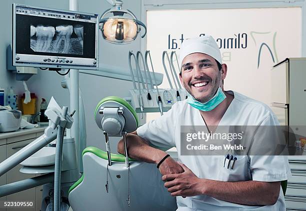 portrait of dentist in clinic - dentista imagens e fotografias de stock