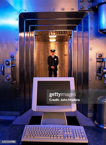 computer in front of bank guard and vault - the old guard stock pictures, royalty-free photos & images