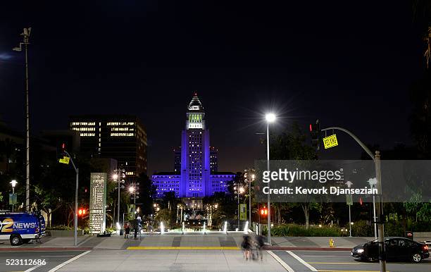 Los Angeles City Hall is lit up in purple in memory of musician Prince on April 21 in Los Angeles, California. Prince, who was 57, died at his estate...