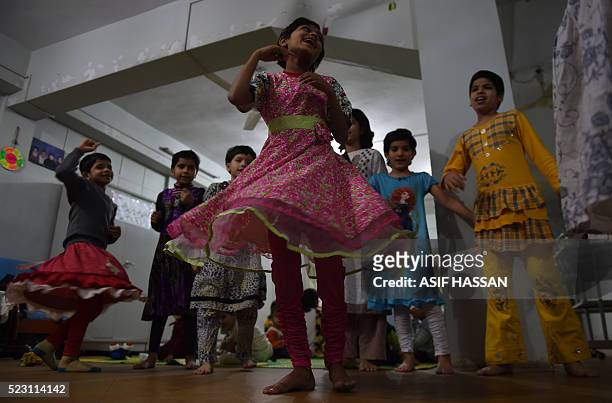In this photograph taken on February 15 orphaned children play at the Edhi Foundation in the port city of Karachi. He created a charitable empire out...
