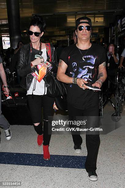 Slash and Meegan Hodges are seen at LAX on April 21, 2016 in Los Angeles, California.