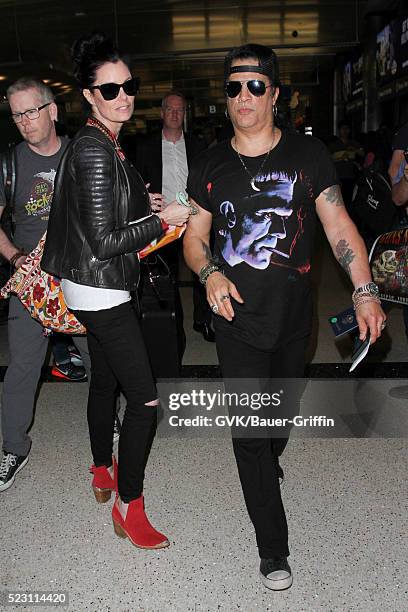 Slash and Meegan Hodges are seen at LAX on April 21, 2016 in Los Angeles, California.