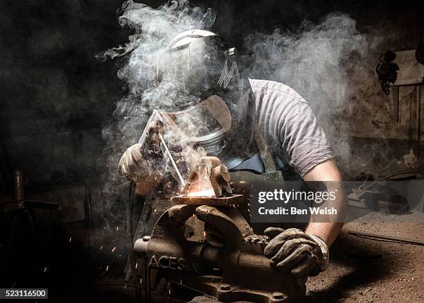 man welding metal - one mid adult man only stock pictures, royalty-free photos & images