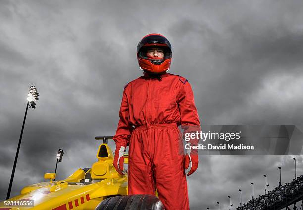 racecar driver by open-wheel single-seater racing car racecar - rennfahrer stock-fotos und bilder