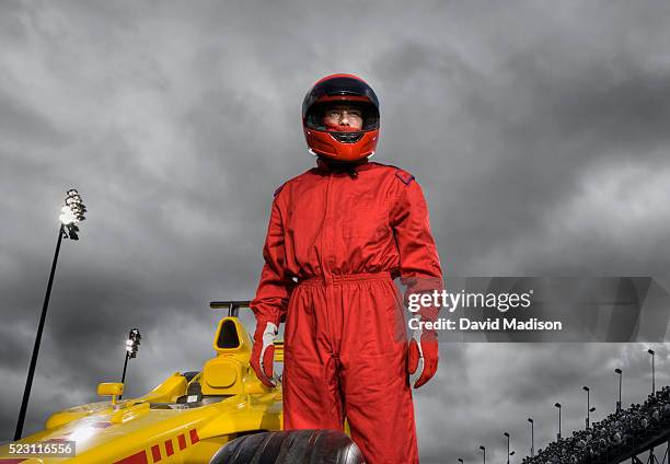 racecar driver by open-wheel single-seater racing car racecar - racing car driver stockfoto's en -beelden