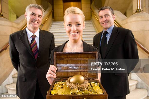 businesspeople with a treasure chest - treasuregold bildbanksfoton och bilder