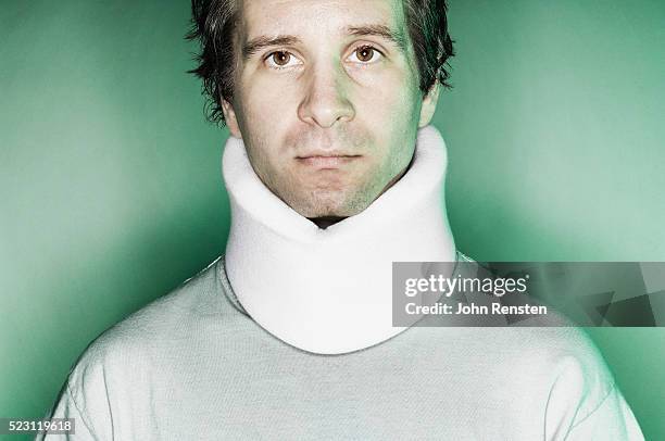 man wearing a neckbrace - cervical collar stock pictures, royalty-free photos & images