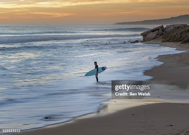 lonely surfer. - tarifa stock pictures, royalty-free photos & images