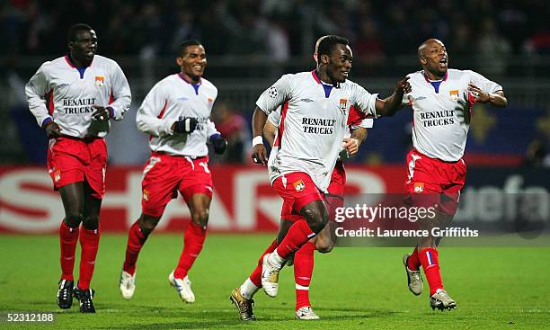 Fabian Ernst of Lyon celebrates scoring the second goal with Sylvain Wiltord during the UEFA Champions League First Knock-Out, Second Leg match...